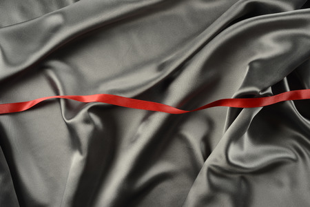 Effects of light in one gray satin fabricの写真素材