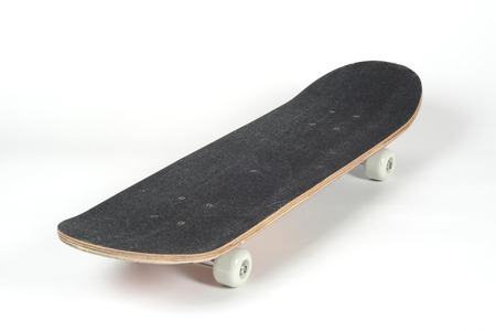 Black skateboard on white backgroundの写真素材