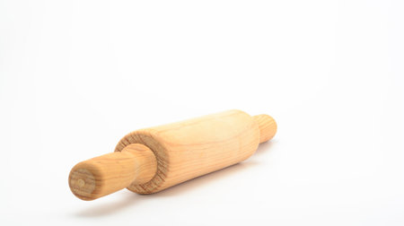 Wooden rolling pin for cooking on white background