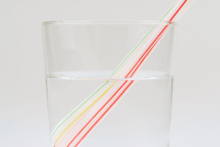 Glass of water and straw, refractiveの写真素材