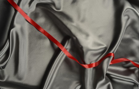 Effects of light in one gray satin fabricの写真素材