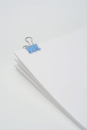 Several documents separated by tweezers