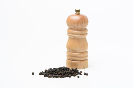 Pepper mill and black pepperの写真素材