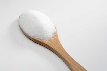 Fine salt in wooden spoonの写真素材