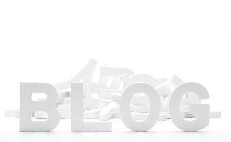 BLOG written in white wooden letters on white backgroundの写真素材