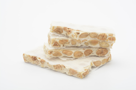 Hard almond nougat on white backgroundの写真素材