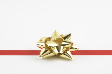 Shaped ribbon bows for gifts and red ribbon on white backgroundの写真素材