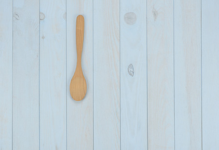 Kitchen items: wooden spoon on blue backgroundの写真素材