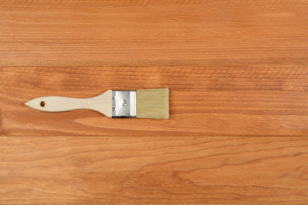 Brush on wooden background, view from above