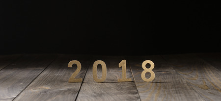 New year 2018 in gold letters on wooden backgroundの写真素材
