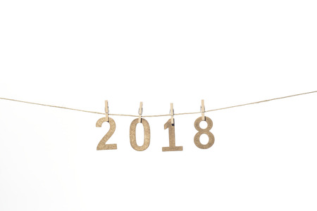 New year 2018 in numbers of golden numbers of wood hanging on a ropeの写真素材