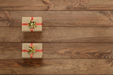 Gift boxes on wooden background, composition as a cardの写真素材