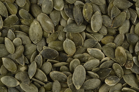 Peeled pumpkin seeds, composition as backgroundの写真素材