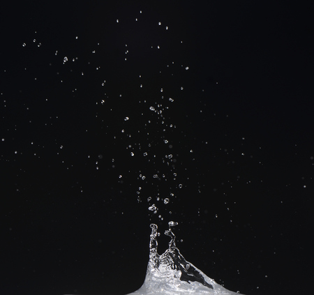 Water moving on black background, water dropletsの写真素材