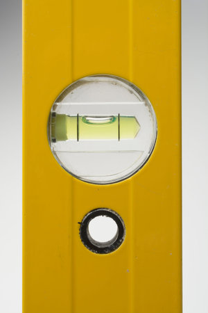 Bubble spirit water level construction tool on wooden board