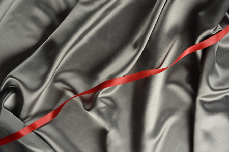 Effects of light in one gray satin fabricの写真素材