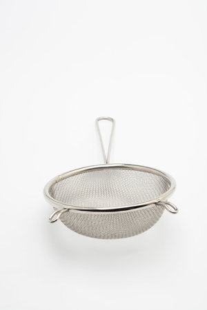 Steel strainer isolated on white background