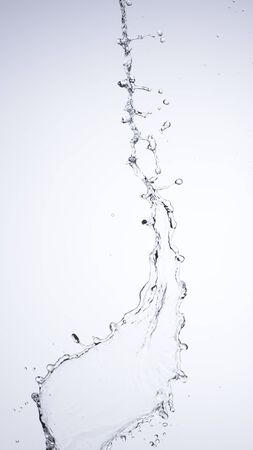 Moving water on white background, jets and dropsの写真素材