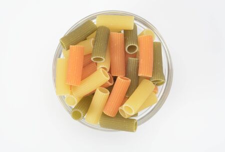 Macaroni in three differents colors, raw pastaの写真素材