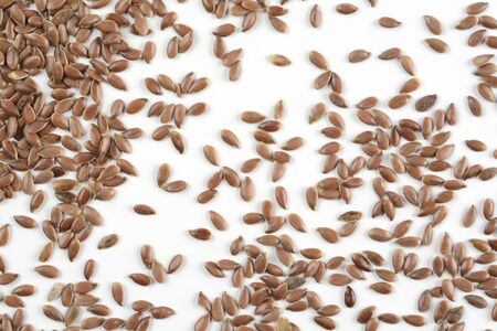 Brown flax seeds on white background, detailの写真素材