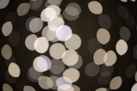 Defocused lights on the black background, optic effect