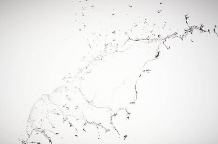 Water jet on white background, splashes and dropsの写真素材