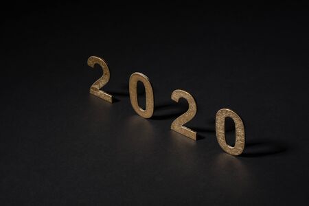 New year 2020 in golden numbers on white background, composition as a postalの写真素材