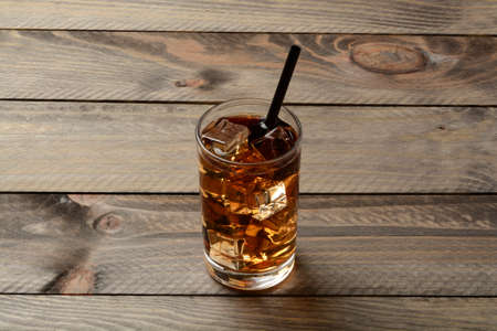Glass of ice tea on the wooden tableの写真素材