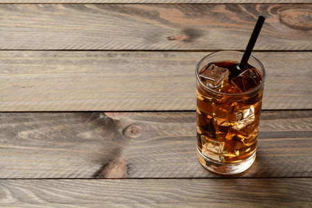 Glass of ice tea on the wooden tableの写真素材