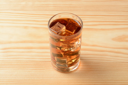 Glass of ice tea on the wooden tableの写真素材