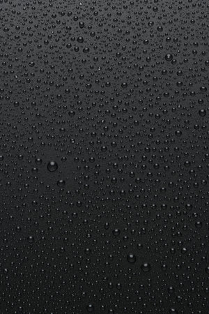 Water drops on rough black background, textureの写真素材