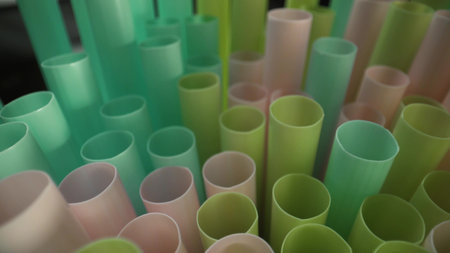 Colorful cocktail tubules on black background.の写真素材