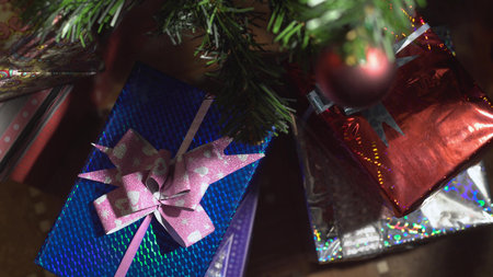 christmas presents underneath the christmas tree.