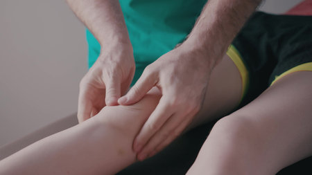 Attractive young woman receiving a massage in a health club.