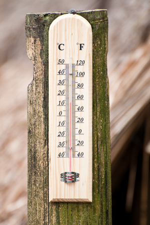 Temperature on brown bamboo with brown backgroundの写真素材