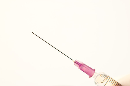 Medical - Syring with hand and white の写真素材