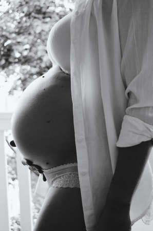 belly of pregnant woman monochromeの写真素材