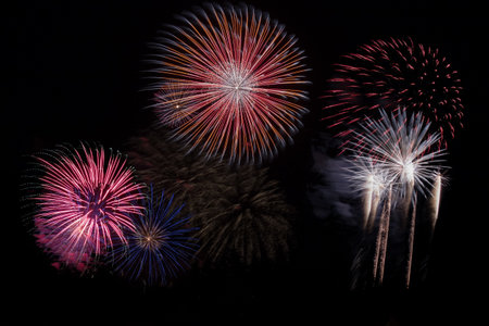 Brightly Colorful Fireworks on the background of the night sky.の写真素材