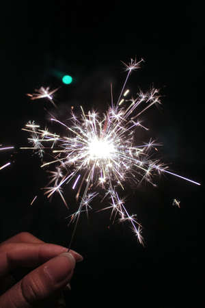 Realistic sparks of weld metal blade, firework petard flare, comet trail. Bright glowing sparkling light of electric circular saw, flying asteroid isolated on black background.の写真素材