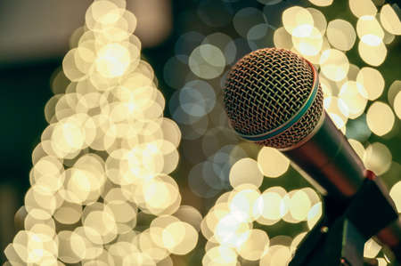 A microphone isolated on a white bokeh backgroundの写真素材