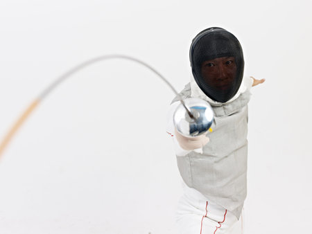 male asian fencer in action.