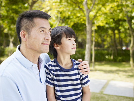 outdoor portrait of an asian father and son.の写真素材