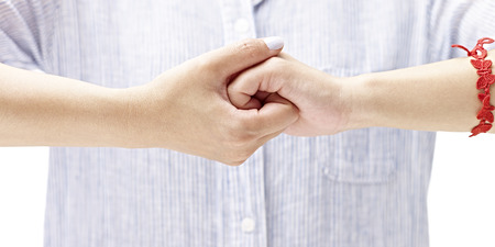 hands of a woman held together, isolated on white backgroundの写真素材