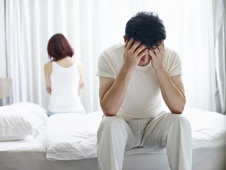 young asian couple with relationship problem appear depressed and frustrated.の写真素材