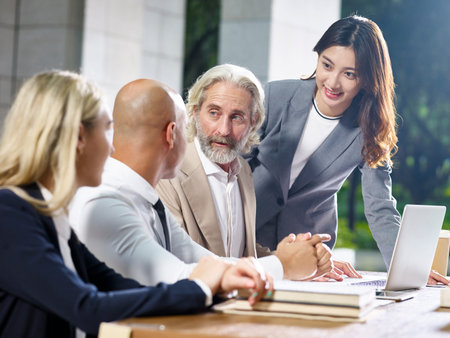 multiethnic group of corporate business people meeting in office
