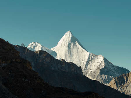 Yangmaiyong (or Jampayang in Tibetan language) mountain peak under the blue sky in Yading, Daocheng County, Sichuan Province, Chinaの素材 [FY310185456442]