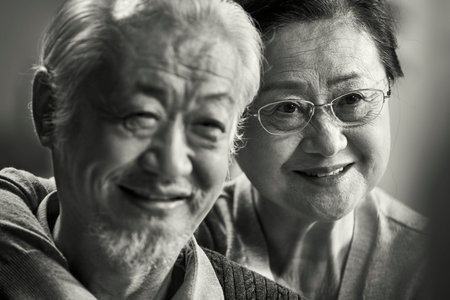 black and white portrait of happy loving senior asian couple