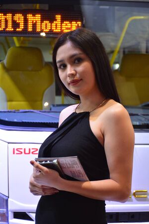 PASAY, PH - AUG. 17: Isuzu G-Tecnica truck female model on August 17, 2018 at Transport and Logistics in World Trade Center Metro Manila, Pasay, Philippines.のeditorial素材