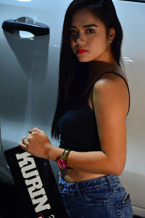 PASAY, PH - NOV. 6: Kurin offroad female model at Manila Auto Salon on November 6, 2016 in SMX Convention Center, Pasay, Philippines.のeditorial素材