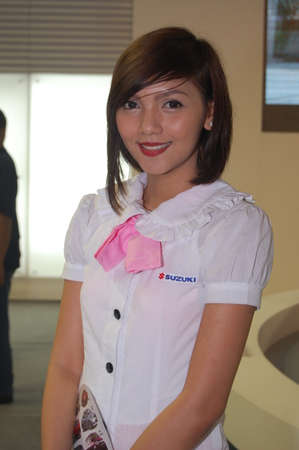 PASAY, PH - AUG. 19: Suzuki female model at 3rd Philippine International Motor Show on August 19, 2010 in World Trade Center Metro Manila, Pasay, Phillippines.のeditorial素材